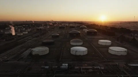 Oil and Gas Extraction Facility and industry energy plant at Sunset Aerial Stock Footage 325959062