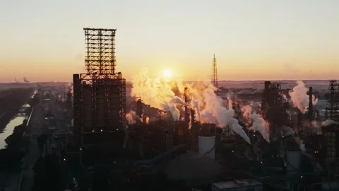 Oil and Gas Extraction Operations at Sunset in Industrial Landscape Stock Footage 325959120