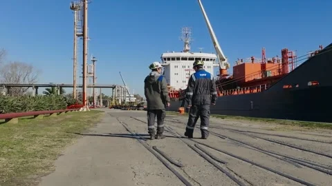 Oil and Gas Workers at Extraction Site with Industrial Scenes on Sunny Day Stock Footage 326265955