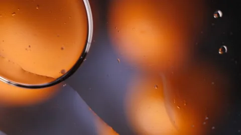 Oil and paint macro bubbles on glass colorful background Stock Footage 138460942