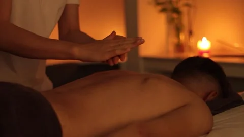 Oil Applied on Man That Is Massaged on Back by a Professional Massage Therapist Stock Footage 241324833