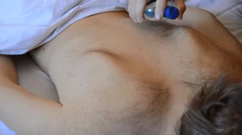 Oil Applied to a Mans Back Stock Footage 47501814