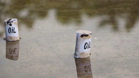 Oil barrels float on the surface of the water Stock Footage 108981076