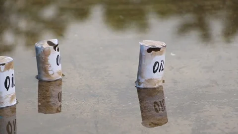 Oil barrels float on the surface of the water Stock Footage 109130050
