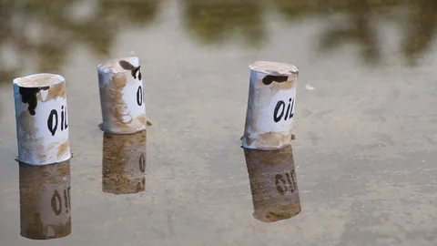 Oil barrels float on the surface of the water Stock Footage 110733174
