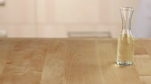 Oil being poured into a baking dish Stock-Footage 24671734