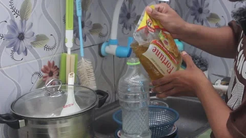 Oil into bottles Stock Footage 276150513