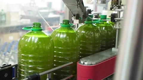 Oil bottling process in an agricultural mill Selective focus. Stock Footage 139028313