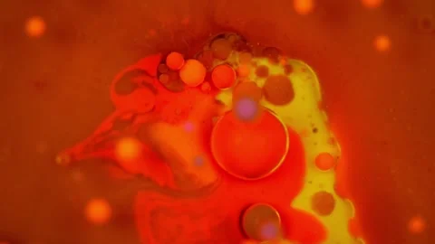 Oil bubbles. Color experiments in slow motion. One of the bubbles bursts. Stock Footage 281245818