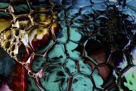 Oil bubbles inside water base form patterns Stock Illustration