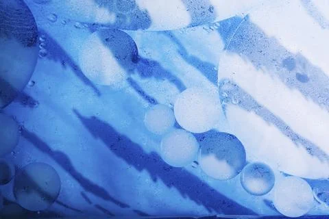 Oil bubbles inside water base form patterns Stock Illustration