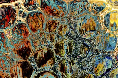 Oil bubbles inside water base form patterns Stock Illustration