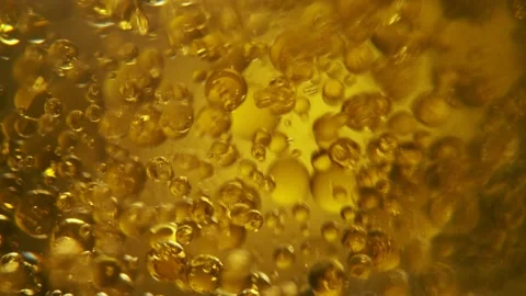 Oil Bubbles on Light Beige Background Stock Footage 169958614