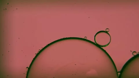 Oil bubbles, streaks on water in light brown light, macroscopic Stock Footage 168129662