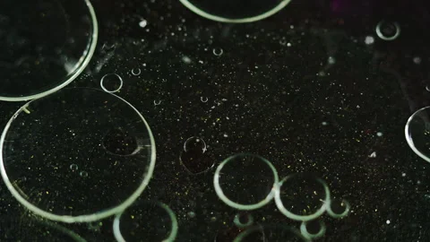 Oil bubbles texture gel drops glitter water black Stock-Footage 267789246
