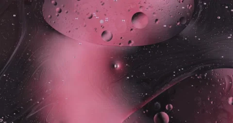 Oil bubbles on water abstract form in glass tank. Video stock 150398010