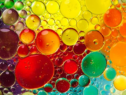 Oil bubbles in water Stock Photos