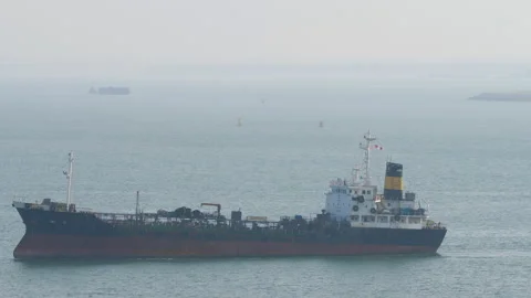Oil bunker tanker ship navigating through sea in Singapore Stock Footage 335544101