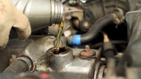 Oil change in car Stock Footage 80454892