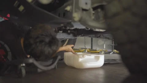 An Oil Change at a Car Workshop Stock Footage 157770037
