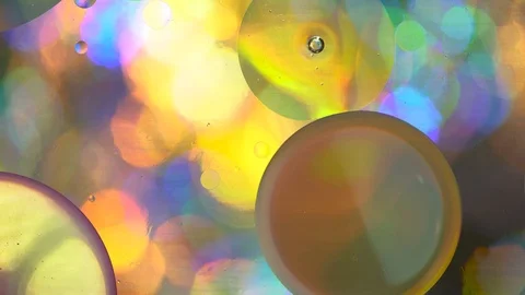 Oil circles in water on a colored background Stock Footage 108469393