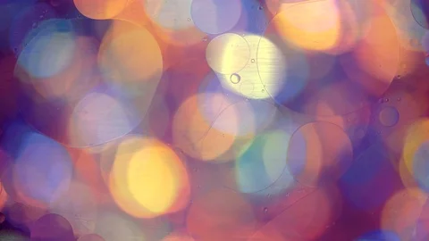 Oil circles in water on a colored background Stock Footage 108471321