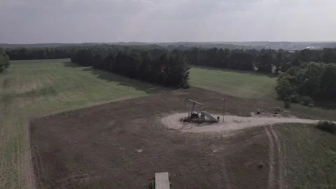 Oil Derrick in a Field Stock Footage 248799314
