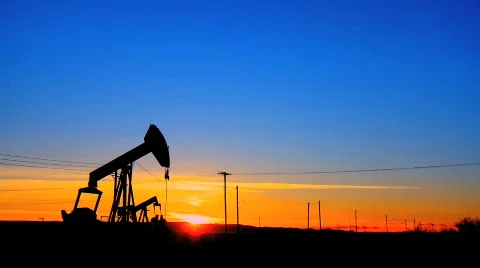 Oil donkeys at sunset Stock Footage