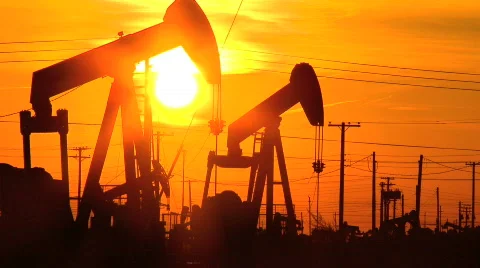Oil donkeys at sunset Stock Footage