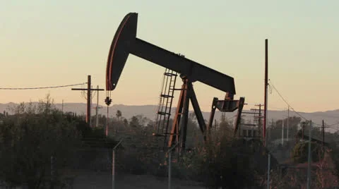 Oil drill at dusk Video stock 23663912
