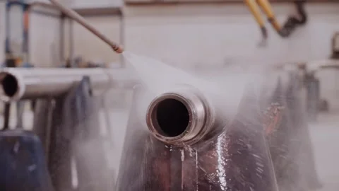 Oil drilling pipe being cleaned and washing with high pressure water jet. Stock Footage 316162224