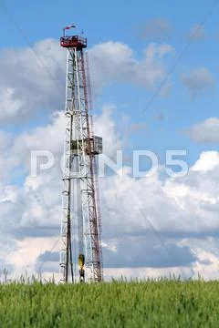 Oil drilling rig and blue sky Stock Photos