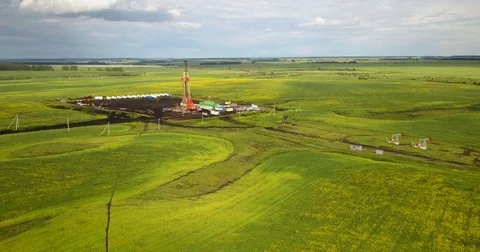 Oil drilling rig in the field Stock Footage 77483320
