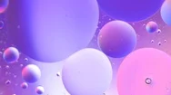 Oil Drop In Water Macro. Neon Purple Pink Ultraviolet And Blue Gradient Stock Footage