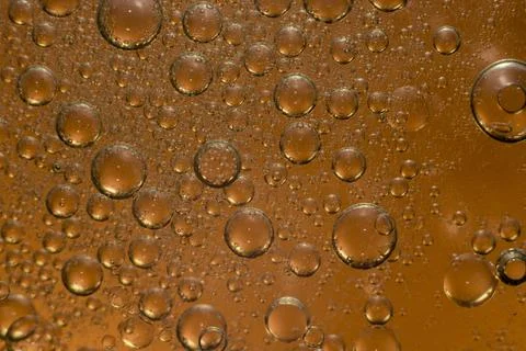 Oil Drops Isolated on orange Stock Photos