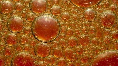 Oil Drops Isolated on red Stock Photos
