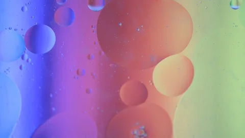 Oil drops moving in water Stock Footage 118960853