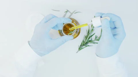 Oil drops from pipette into bottle.  Stock Footage 171219732