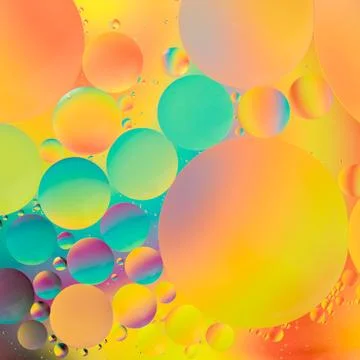 Oil drops on water Stock Photos