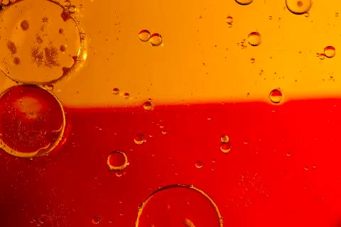 Oil drops on a water surface Stock Photos
