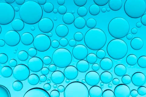 Oil drops on a water surface Stock Photos