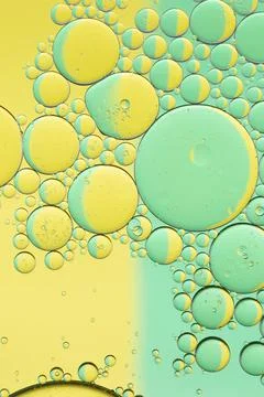 Oil drops on a water surface Stock Photos