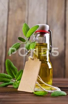 Oil with dry leaves of sage Stock Photos