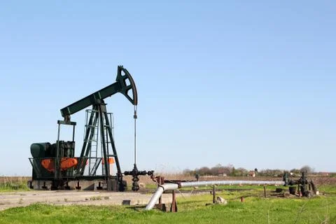 Oil field with pump jack.JPG Stock Photos