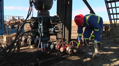 Oil Field Worker Turns Valve Stock-Footage 40367294