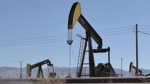 Oil Fields Vertical and power lines For Editorial Use Only Stock Footage 147459250
