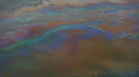 Oil floating on water surface Stock Footage 66688225