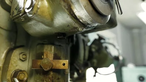 The oil flows from the old rusty metal processing machine, drop of machine oil Stock Footage 284545614