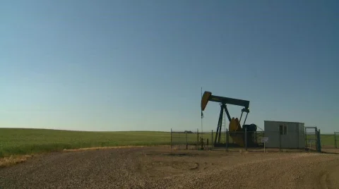 Oil & gas, evening pumpjack Stock Footage