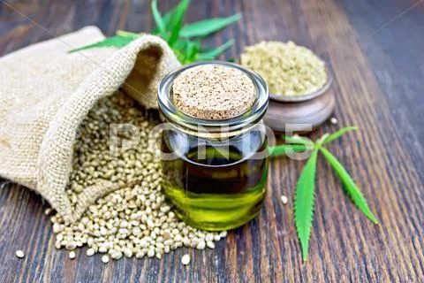 Oil hemp with flour on board Stock Photos
